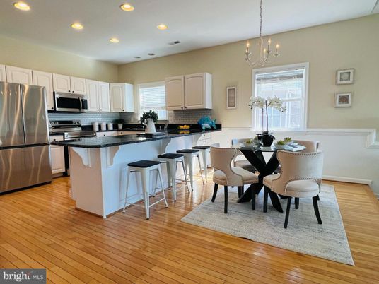 Chandelier, Dining room, Interior, Kitchen, Pendant Lights, Recessed Lighting, Stainless Steel Appliances, Wood Texture Flooring