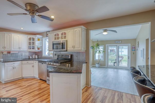 Fireplace, Interior, Kitchen, Recessed Lighting, Wood Texture Flooring