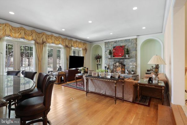 Dining room, Fireplace, Interior, Living room, Recessed Lighting, Stone Walls, Wood Texture Flooring