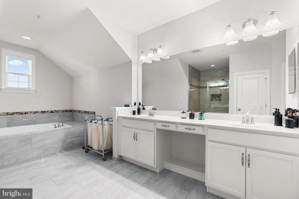Bathroom, Dual Sink Vanities, Glass Shower, Interior, Recessed Lighting, Wood Texture Flooring