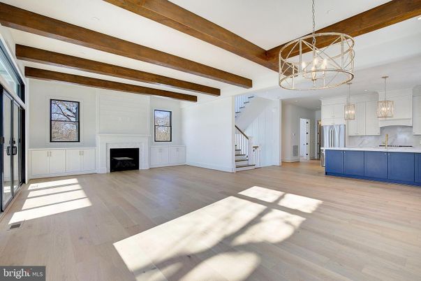Chandelier, Empty room, Fireplace, Interior, Kitchen, Pendant Lights, Recessed Lighting, Wooden Beams, Wood Texture Flooring