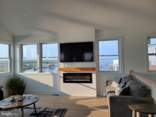 Fireplace, Interior, Recessed Lighting, Water, Wood Texture Flooring