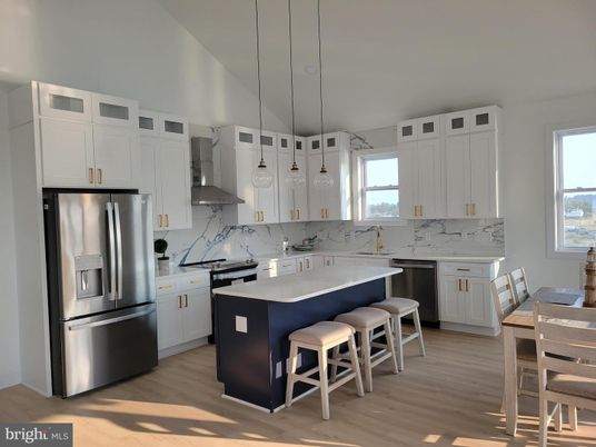 Interior, Kitchen, Marble Walls, Pendant Lights, Stainless Steel Appliances, Wood Texture Flooring