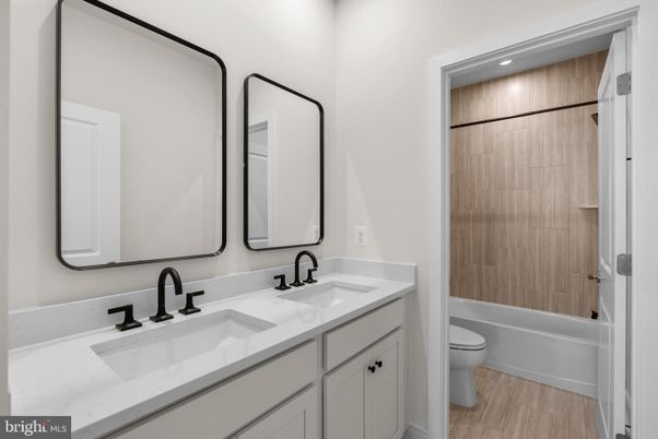 Bathroom, Dual Sink Vanities, Interior, Recessed Lighting, Wood Texture Flooring