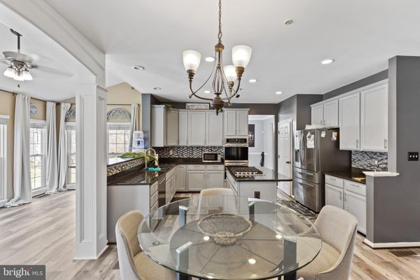 Chandelier, Dining room, Interior, Kitchen, Pendant Lights, Recessed Lighting, Stainless Steel Appliances, Wood Texture Flooring