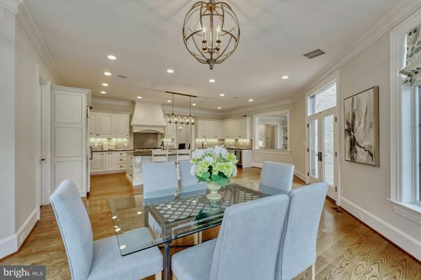 Chandelier, Dining room, Interior, Kitchen, Pendant Lights, Recessed Lighting, Stainless Steel Appliances, Wood Texture Flooring