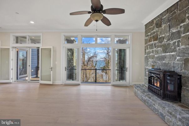 Empty room, Fireplace, Interior, Recessed Lighting, Stone Walls, Wood Texture Flooring