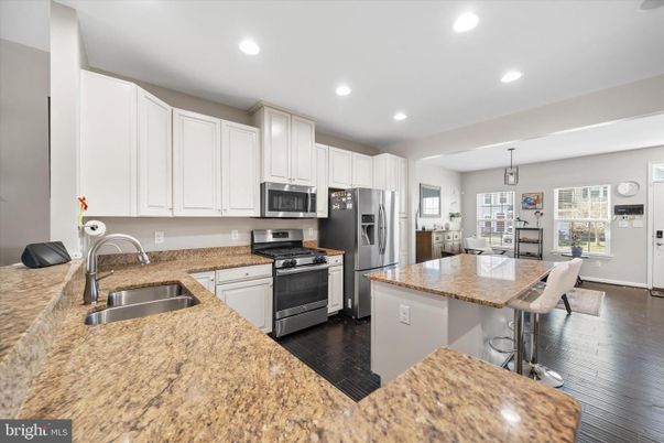 Dining room, Interior, Kitchen, Recessed Lighting, Stainless Steel Appliances, Wood Texture Flooring