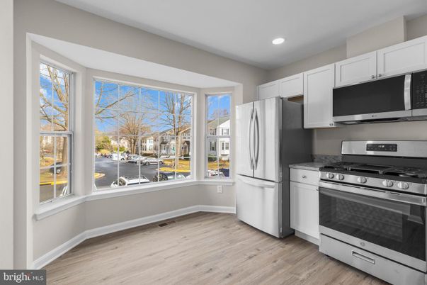 Interior, Kitchen, Recessed Lighting, Stainless Steel Appliances, Water, Wood Texture Flooring
