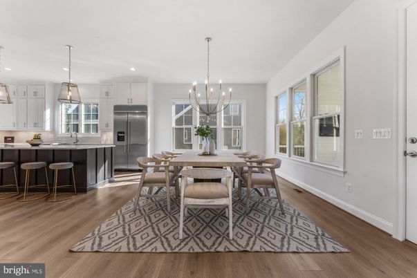 Chandelier, Dining room, Interior, Kitchen, Pendant Lights, Recessed Lighting, Stainless Steel Appliances, Wood Texture Flooring