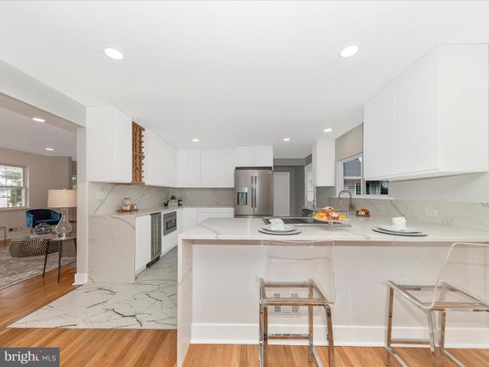 Interior, Kitchen, Marble, Marble Walls, Recessed Lighting, Stainless Steel Appliances, Wood Texture Flooring
