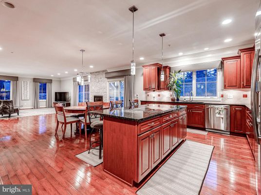 Dining room, Fireplace, Interior, Kitchen, Pendant Lights, Recessed Lighting, Stainless Steel Appliances, Stone Walls, Wood Texture Flooring