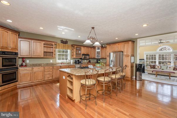 Chandelier, Interior, Kitchen, Living room, Recessed Lighting, Stainless Steel Appliances, Wood Texture Flooring