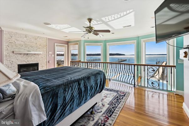 Bedroom, Fireplace, Interior, Stone Walls, Water, Wood Texture Flooring