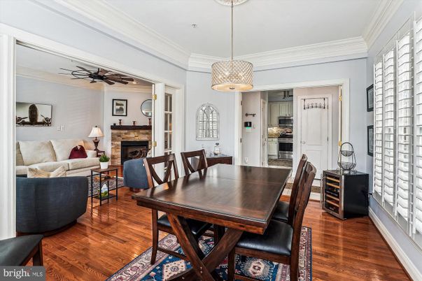 Dining room, Fireplace, Interior, Kitchen, Living room, Pendant Lights, Stainless Steel Appliances, Wood Texture Flooring