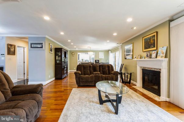 Dining room, Fireplace, Interior, Living room, Pendant Lights, Recessed Lighting, Wood Texture Flooring