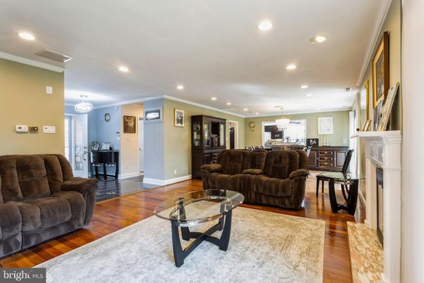 Chandelier, Dining room, Fireplace, Interior, Kitchen, Living room, Pendant Lights, Recessed Lighting, Wood Texture Flooring
