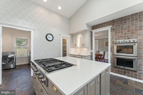 Interior, Kitchen, Recessed Lighting, Stainless Steel Appliances, Stone Walls