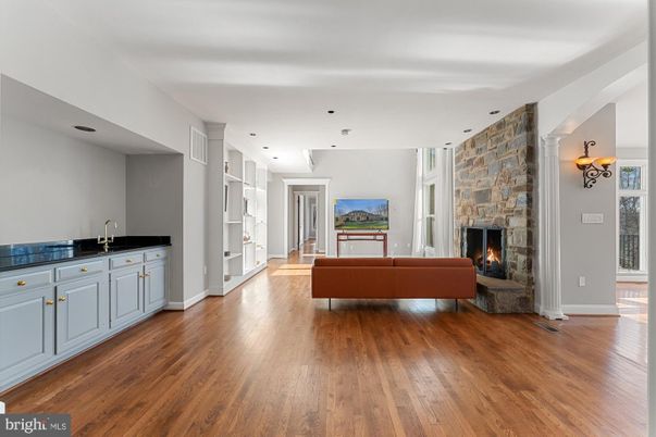 Fireplace, Interior, Living room, Recessed Lighting, Stone Walls, Wood Texture Flooring