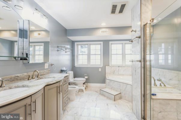 Bathroom, Dual Sink Vanities, Glass Shower, Interior, Marble, Marble Walls, Recessed Lighting