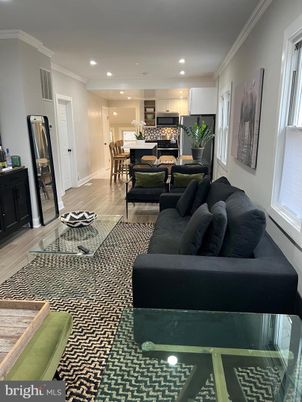 Dining room, Interior, Kitchen, Living room, Recessed Lighting, Stainless Steel Appliances, Wood Texture Flooring