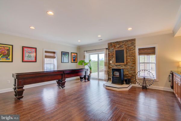 Fireplace, Interior, Recessed Lighting, Stone Walls, Wood Texture Flooring