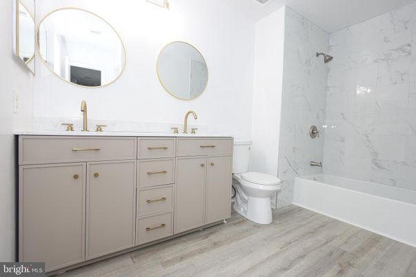 Bathroom, Dual Sink Vanities, Interior, Marble Walls, Wood Texture Flooring
