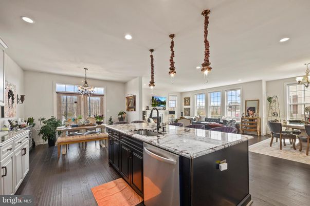 Chandelier, Dining room, Interior, Kitchen, Living room, Pendant Lights, Recessed Lighting, Stainless Steel Appliances, Wood Texture Flooring