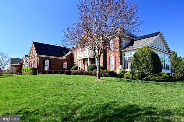 Exterior, Facade, Brick Facade, Solar Panels, Tudor Revival