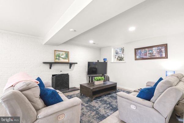 Fireplace, Interior, Living room, Recessed Lighting, Stone Walls, Wood Texture Flooring