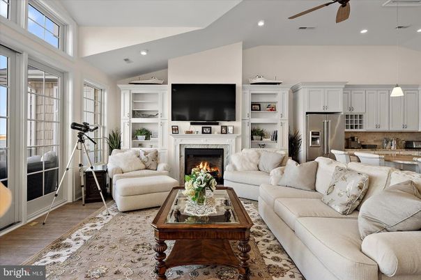 Fireplace, Interior, Kitchen, Living room, Pendant Lights, Recessed Lighting, Stainless Steel Appliances, Wood Texture Flooring