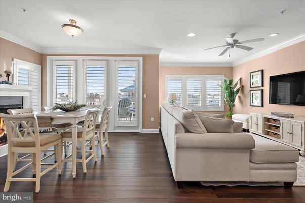 Dining room, Fireplace, Interior, Living room, Recessed Lighting, Wood Texture Flooring