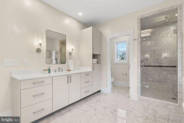 Bathroom, Dual Sink Vanities, Glass Shower, Interior, Marble, Marble Walls, Recessed Lighting