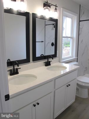 Bathroom, Dual Sink Vanities, Interior, Marble Walls, Wood Texture Flooring