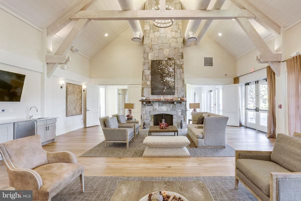 Fireplace, Interior, Living room, Recessed Lighting, Stone Walls, Wood Texture Flooring