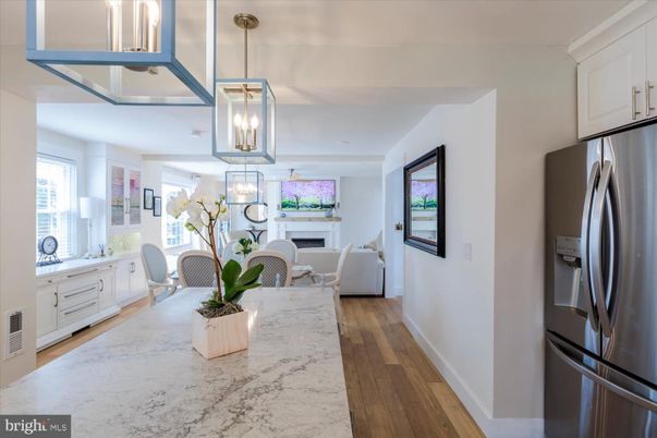 Dining room, Fireplace, Interior, Kitchen, Living room, Pendant Lights, Stainless Steel Appliances, Wood Texture Flooring