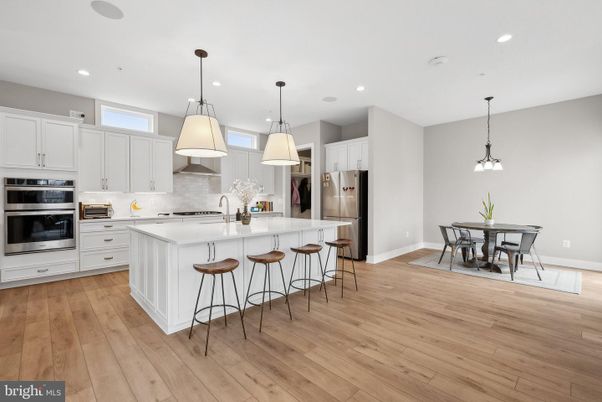 Dining room, Interior, Kitchen, Pendant Lights, Recessed Lighting, Stainless Steel Appliances, Wood Texture Flooring