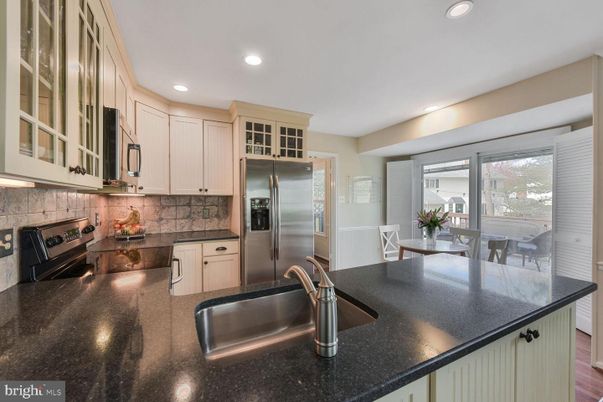 Dining room, Interior, Kitchen, Recessed Lighting, Stainless Steel Appliances, Wood Texture Flooring