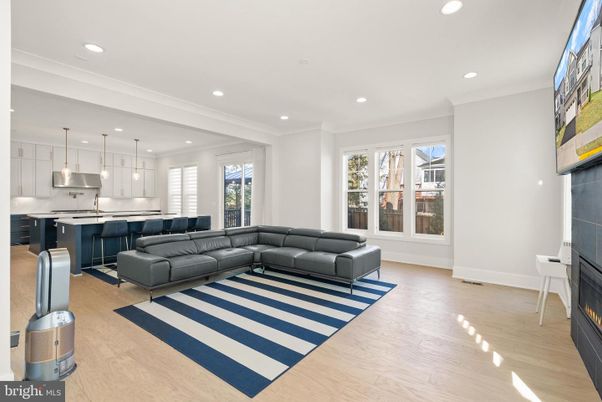 Fireplace, Interior, Kitchen, Living room, Pendant Lights, Recessed Lighting, Stainless Steel Appliances, Wood Texture Flooring