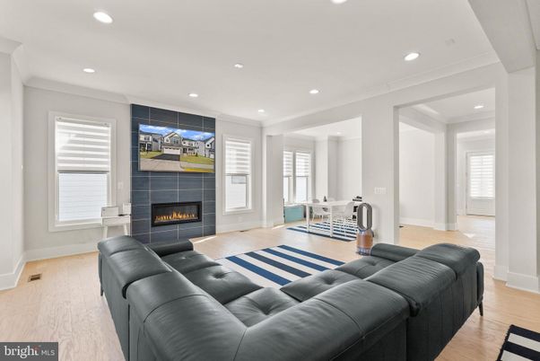 Dining room, Fireplace, Interior, Living room, Recessed Lighting, Wood Texture Flooring
