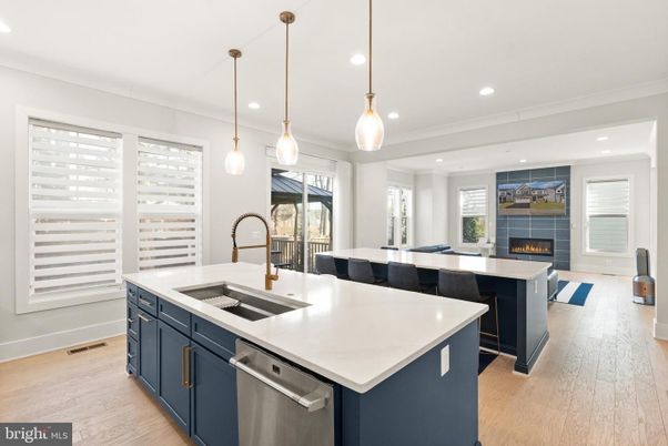 Fireplace, Interior, Kitchen, Pendant Lights, Recessed Lighting, Stainless Steel Appliances, Wood Texture Flooring