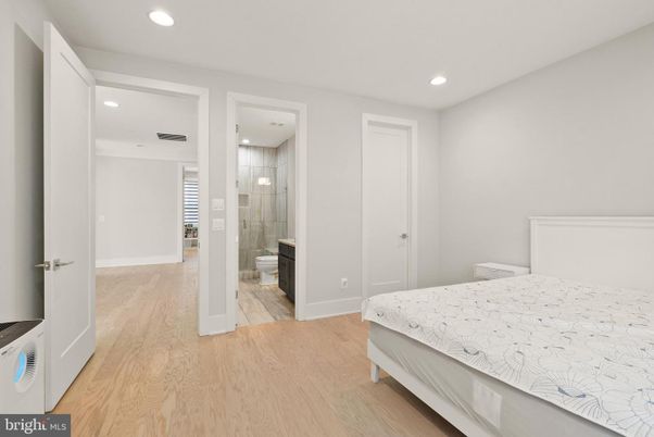 Bathroom, Bedroom, Glass Shower, Interior, Recessed Lighting, Wood Texture Flooring
