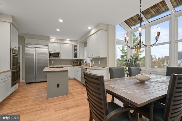 Dining room, Interior, Kitchen, Pendant Lights, Recessed Lighting, Stainless Steel Appliances, Wood Texture Flooring