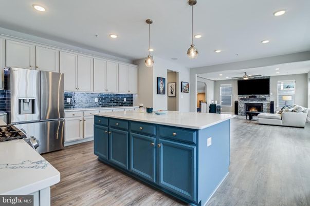Fireplace, Interior, Kitchen, Living room, Pendant Lights, Recessed Lighting, Stainless Steel Appliances, Wood Texture Flooring