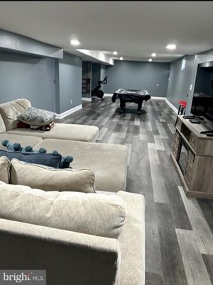 Billiard Table, Fitness Equipment, Game Room, Interior, Living room, Recessed Lighting, Wood Texture Flooring