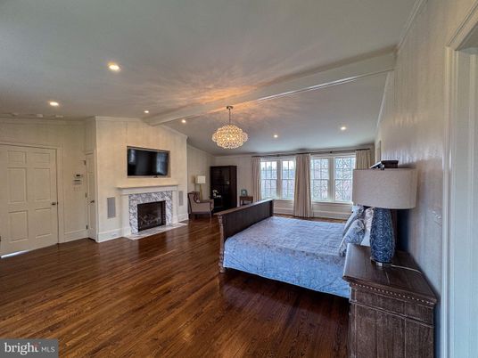 Bedroom, Chandelier, Fireplace, Interior, Recessed Lighting, Wood Texture Flooring