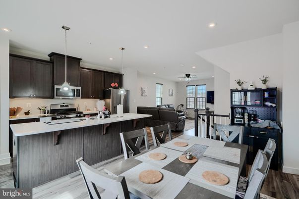 Dining room, Interior, Kitchen, Living room, Pendant Lights, Recessed Lighting, Stainless Steel Appliances, Wood Texture Flooring