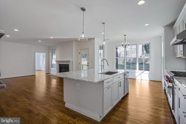 Chandelier, Fireplace, Interior, Kitchen, Pendant Lights, Recessed Lighting, Wood Texture Flooring