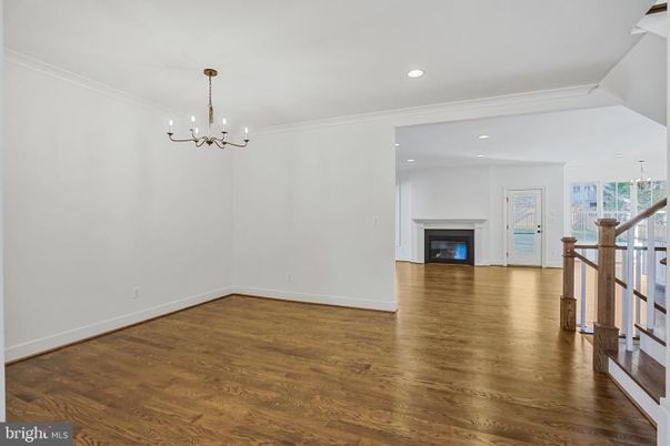 Chandelier, Empty room, Fireplace, Interior, Recessed Lighting, Wood Texture Flooring