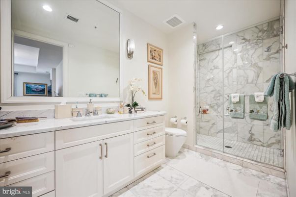 Bathroom, Dual Sink Vanities, Glass Shower, Interior, Marble, Marble Walls, Recessed Lighting